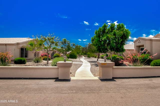 view of property's community featuring a fenced front yard