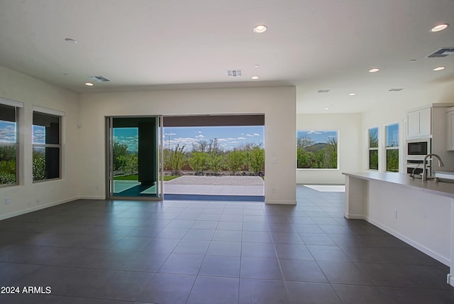 interior space with sink and tile floors