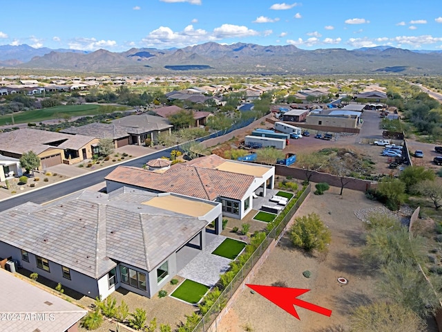 birds eye view of property featuring a mountain view