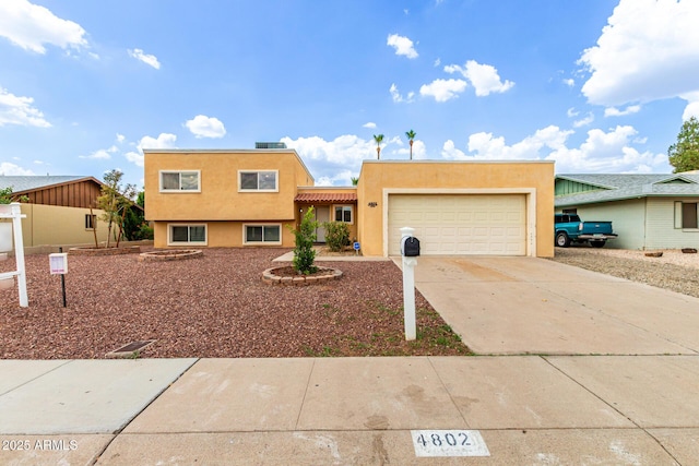 4802 W Hayward Ave, Glendale, AZ 85301 - view of front of home featuring stucco siding, an attached garage, and concrete driveway