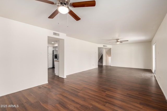 4802 W Hayward Ave, Glendale, AZ 85301 - unfurnished living room with ceiling fan, dark wood-style flooring, stairs, and baseboards