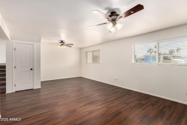 4802 W Hayward Ave, Glendale, AZ 85301 - empty room featuring ceiling fan, dark wood-type flooring, baseboards, and stairs