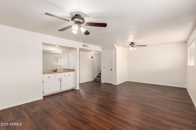 4802 W Hayward Ave, Glendale, AZ 85301 - unfurnished living room with ceiling fan, dark wood-style flooring, stairs, and a sink