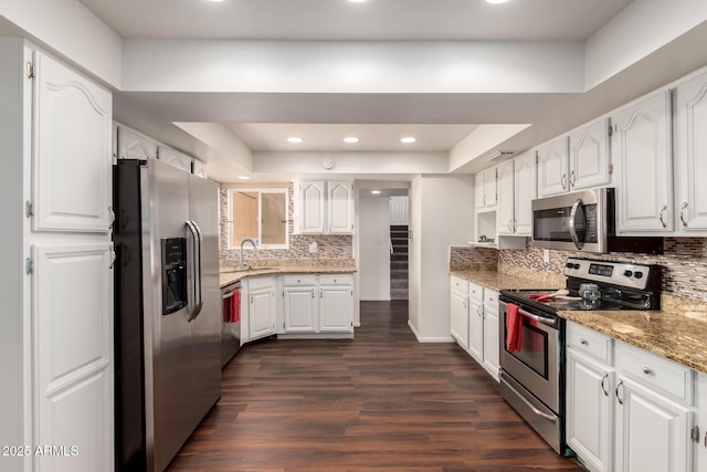 4802 W Hayward Ave, Glendale, AZ 85301 - kitchen featuring appliances with stainless steel finishes, a sink, tasteful backsplash, white cabinetry, and recessed lighting