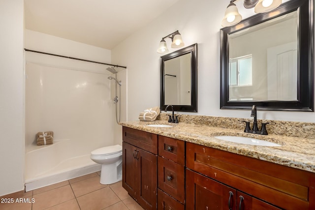 4802 W Hayward Ave, Glendale, AZ 85301 - bathroom with double vanity, a shower, tile patterned floors, and toilet