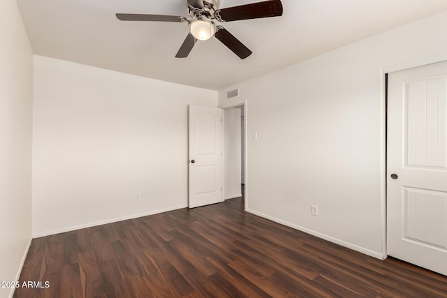 4802 W Hayward Ave, Glendale, AZ 85301 - unfurnished room with dark wood-type flooring, a ceiling fan, and baseboards