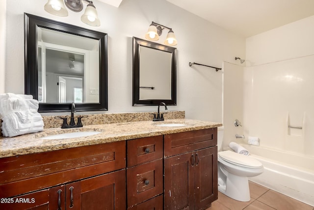 4802 W Hayward Ave, Glendale, AZ 85301 - bathroom with double vanity, tile patterned flooring, toilet, and washtub / shower combination