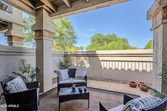 view of patio featuring outdoor lounge area and fence private yard