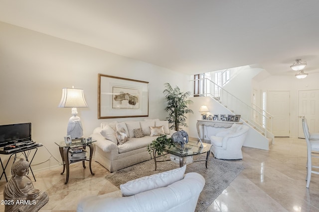 living room with baseboards, stairs, and marble finish floor