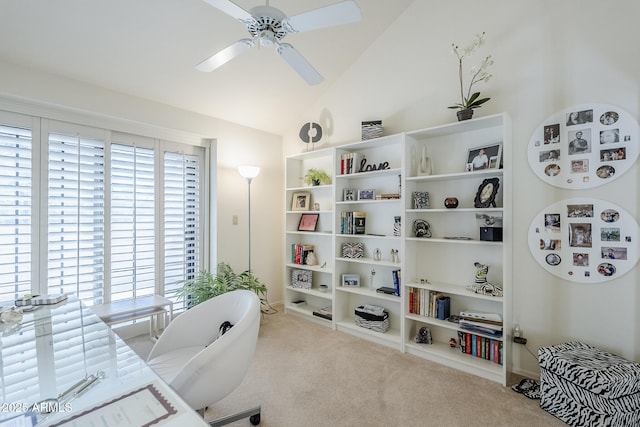 carpeted office with built in features, ceiling fan, and lofted ceiling