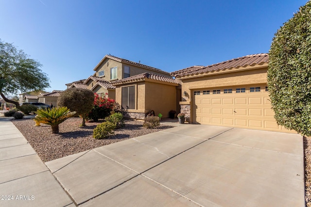 mediterranean / spanish-style home featuring a garage