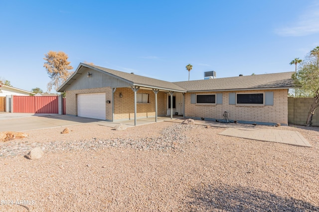 ranch-style house featuring a garage