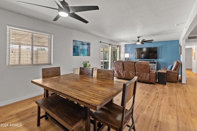 dining room featuring light wood-type flooring and ceiling fan