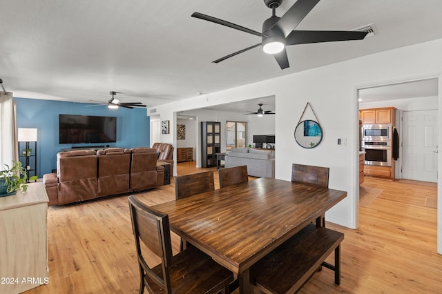 dining space featuring light hardwood / wood-style floors