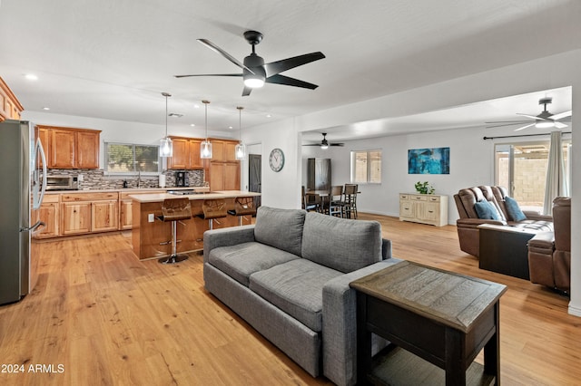 living room featuring light hardwood / wood-style floors and sink