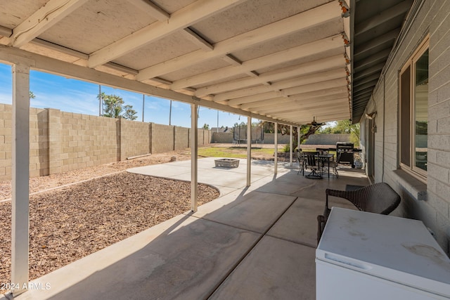 view of patio / terrace with a fire pit