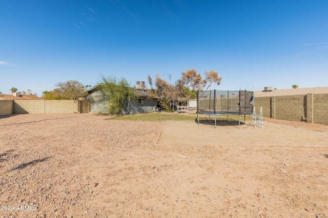 view of yard with a trampoline