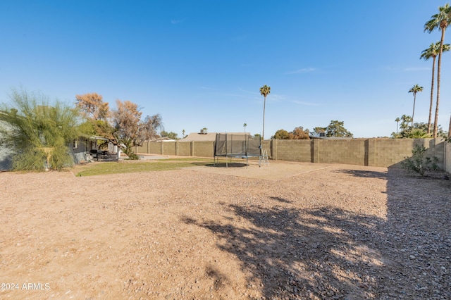 view of yard featuring a trampoline