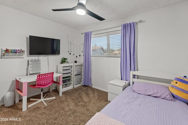 carpeted bedroom featuring a textured ceiling and ceiling fan