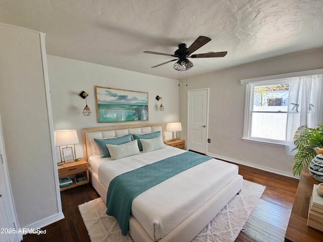 bedroom featuring dark hardwood / wood-style floors and ceiling fan