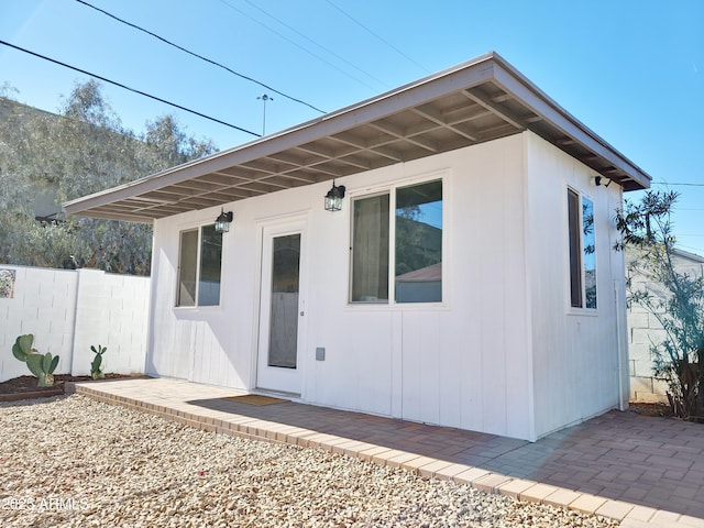 rear view of property featuring a patio area