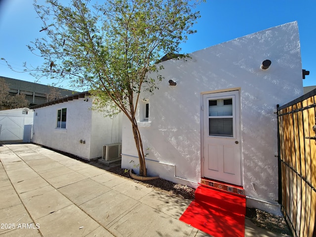 exterior space with a patio area and central air condition unit