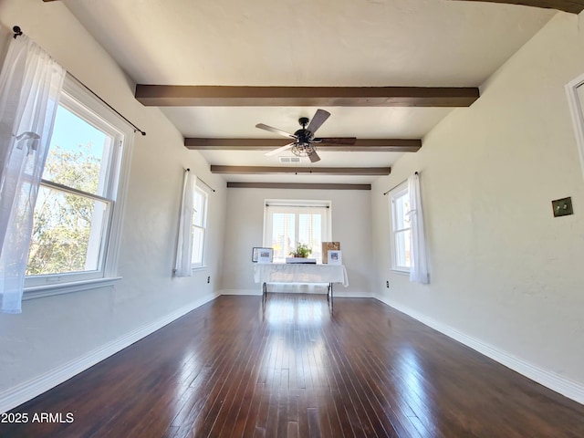 unfurnished room with ceiling fan, dark hardwood / wood-style floors, and beamed ceiling