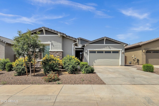2962 E Birdsong Ave, San Tan Valley, AZ 85143 - craftsman-style home featuring a garage, stucco siding, concrete driveway, stone siding, and a tiled roof