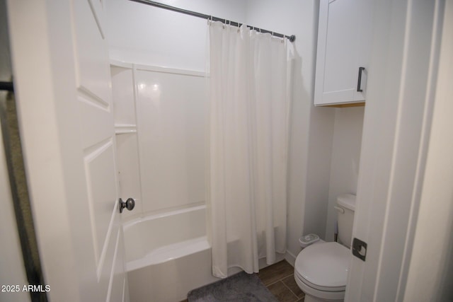 bathroom featuring toilet, shower / bath combo with shower curtain, and wood finished floors