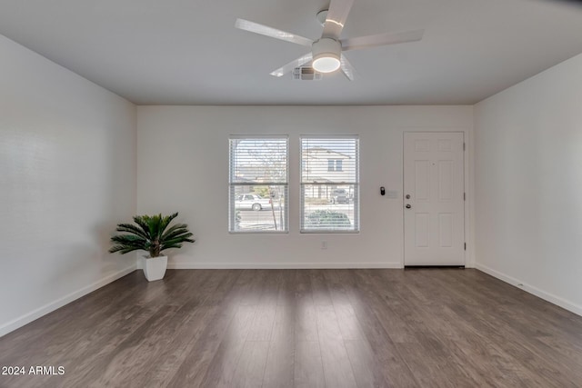 unfurnished room with hardwood / wood-style floors and ceiling fan