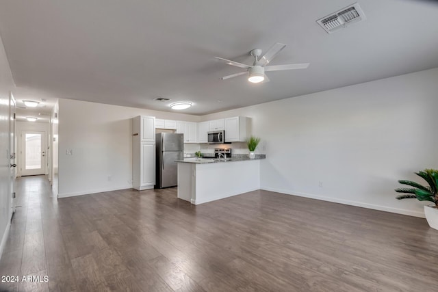 kitchen with white cabinets, ceiling fan, dark hardwood / wood-style flooring, kitchen peninsula, and stainless steel appliances