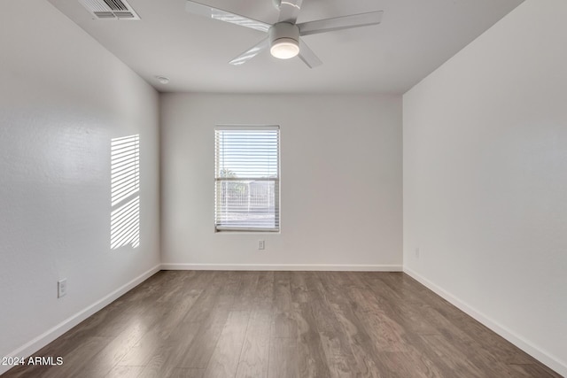 spare room featuring ceiling fan and wood-type flooring