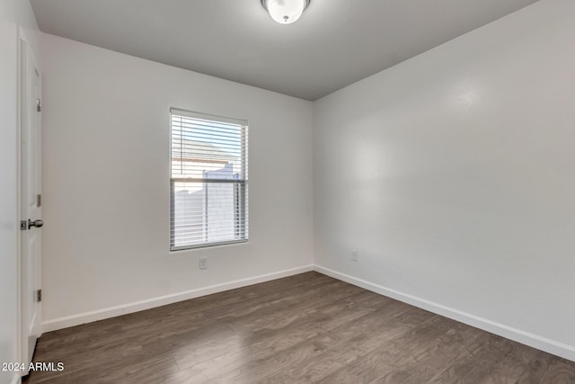 empty room featuring dark wood-type flooring