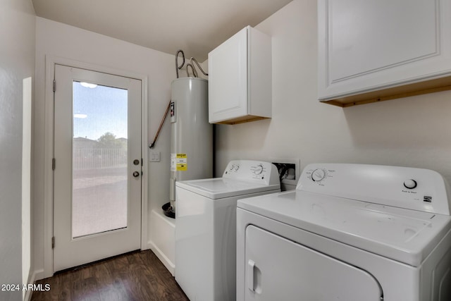 laundry area with cabinets, dark hardwood / wood-style flooring, washing machine and dryer, and water heater