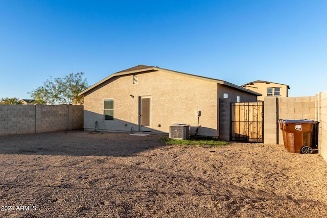 back of property featuring central AC unit