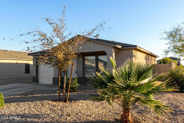 back of house featuring a garage