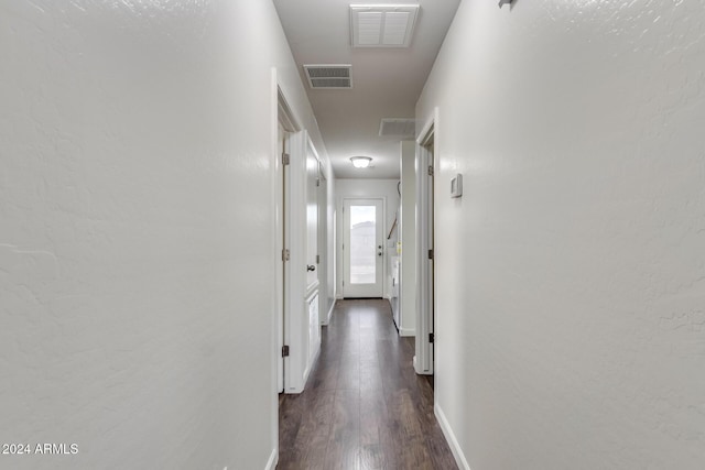 hall featuring dark wood-type flooring