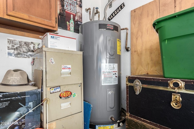 utility room with electric water heater