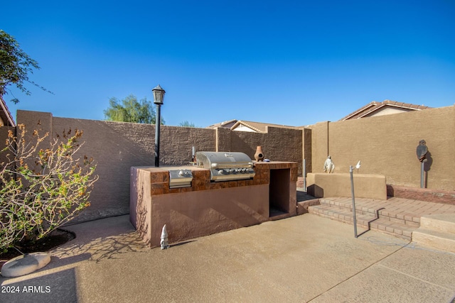 view of patio featuring area for grilling and a fenced backyard