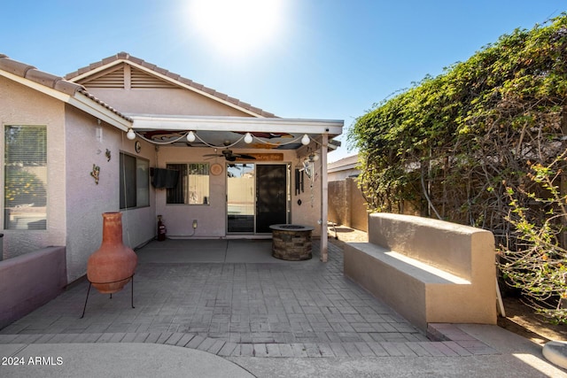 view of patio / terrace featuring fence and a ceiling fan