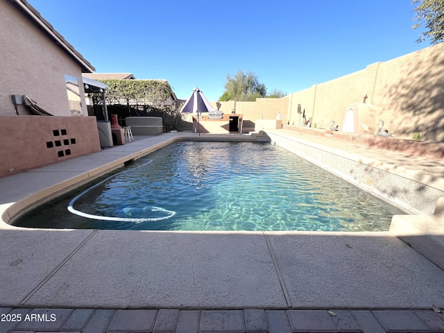 view of swimming pool with a patio area, a fenced backyard, and a fenced in pool