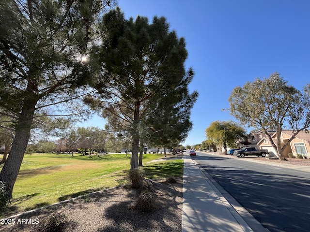 view of road featuring curbs and sidewalks