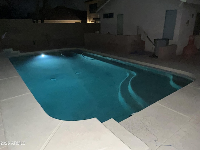view of swimming pool featuring a fenced in pool