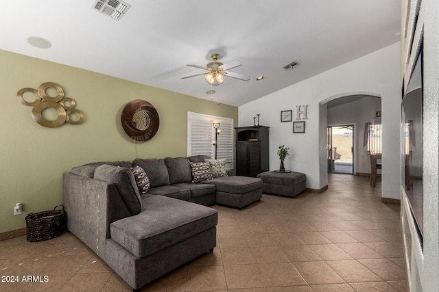 living room with arched walkways, vaulted ceiling, visible vents, and a ceiling fan