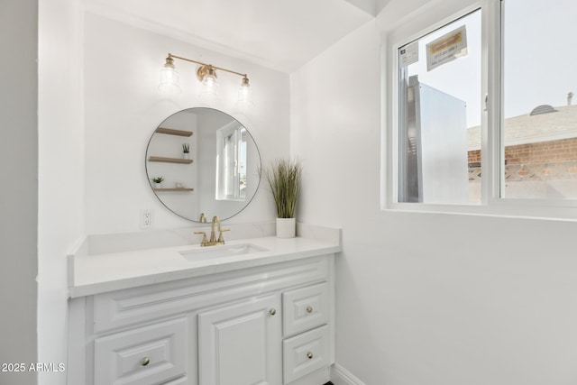 bathroom featuring vanity and baseboards