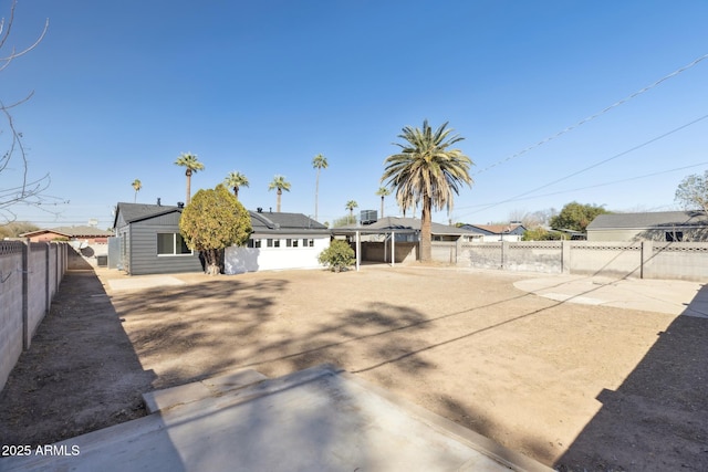 exterior space featuring a fenced backyard