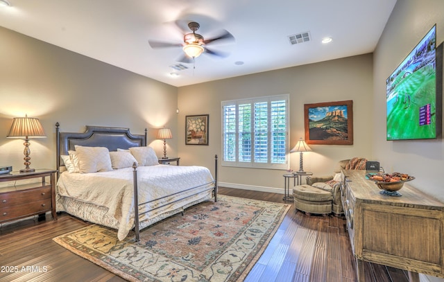 bedroom with dark wood-type flooring and ceiling fan