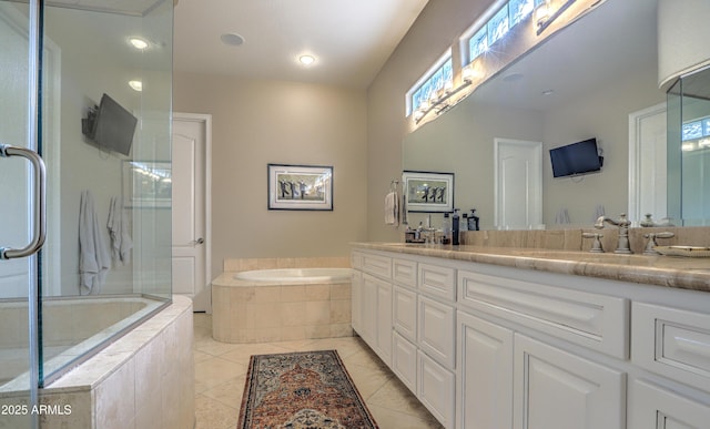 bathroom featuring vanity, tile patterned floors, and shower with separate bathtub