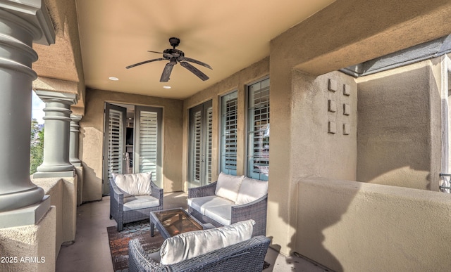 view of patio with an outdoor living space and ceiling fan