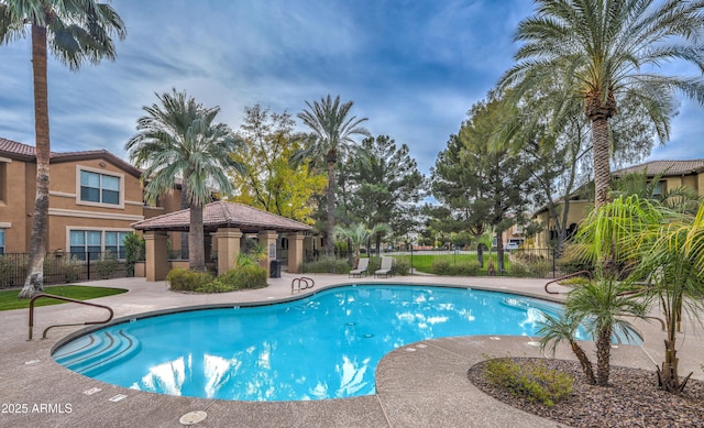 view of swimming pool featuring a gazebo and a patio area